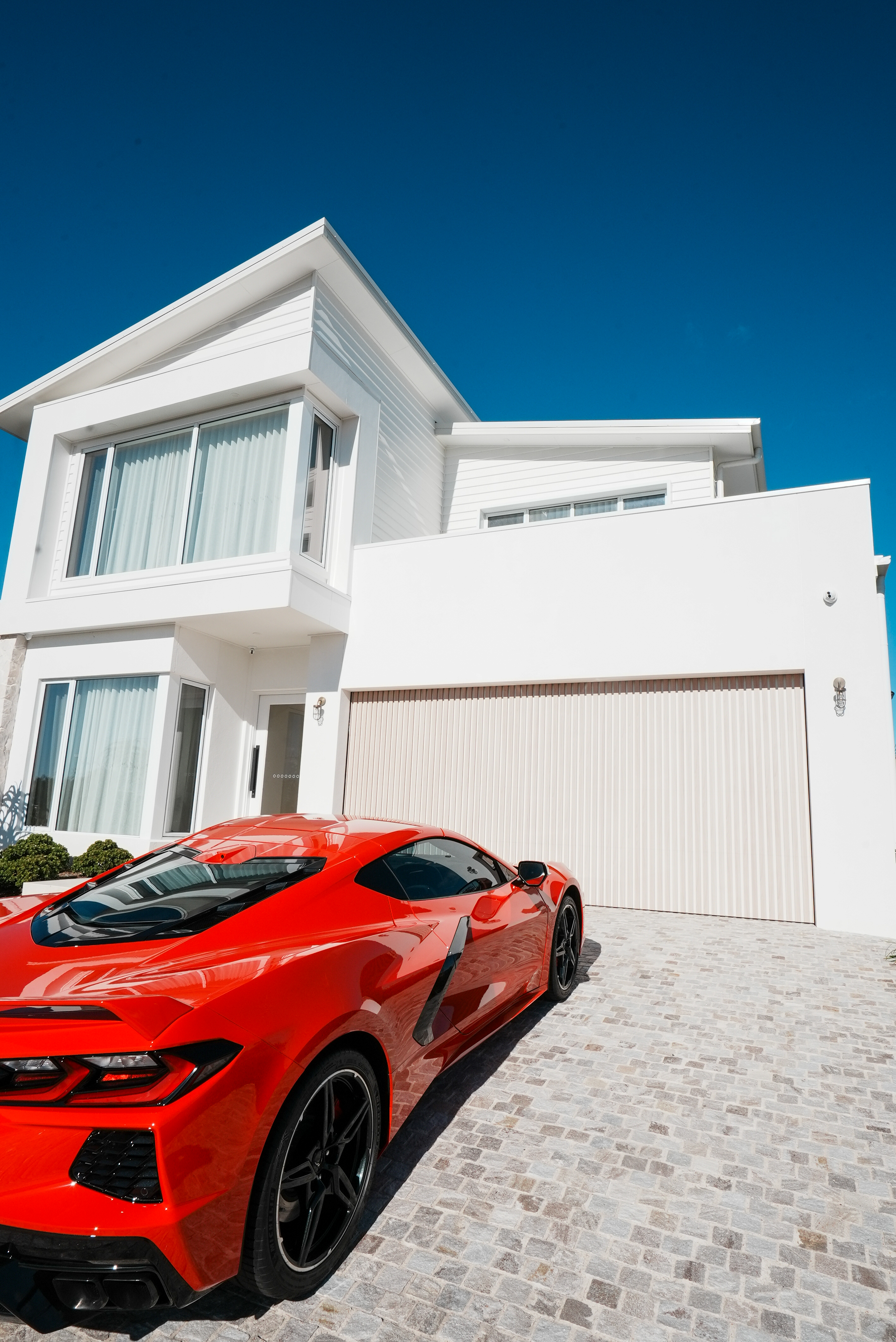 Ferrari and residence front elevation